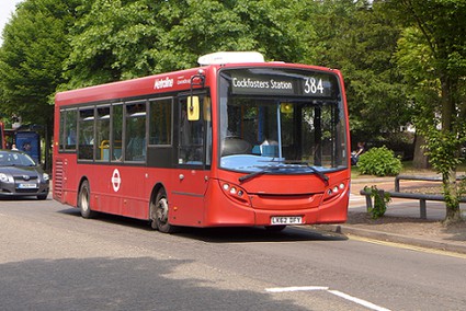 red 384 bus to Cockfosters Station with trees in the background