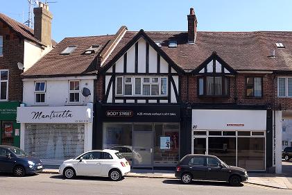 another row of shops with a half timbered gable end