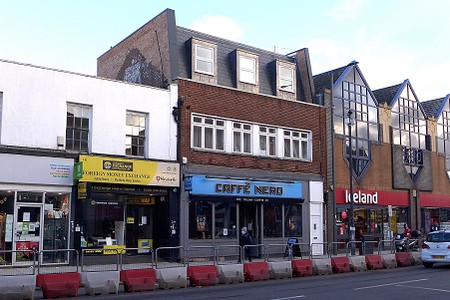 Shop with second floor with enlarged roof and windows