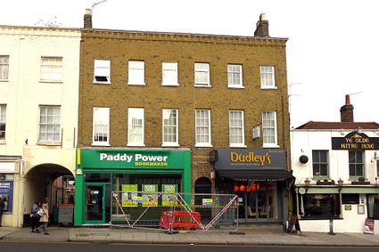 Paddy Power and Dudley's with flats above with glazing bars added to windows