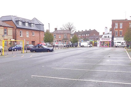 empty car park with abandoned car