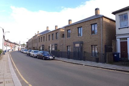 row of houses with square chimneys