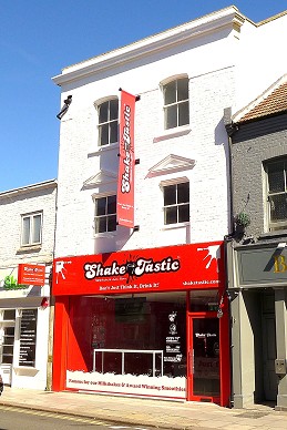 white building with red signage